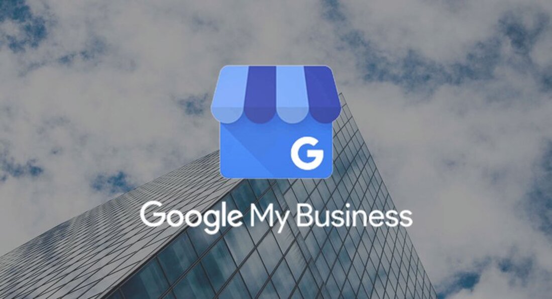 Image contains google my business icon on a background of a building and clouds