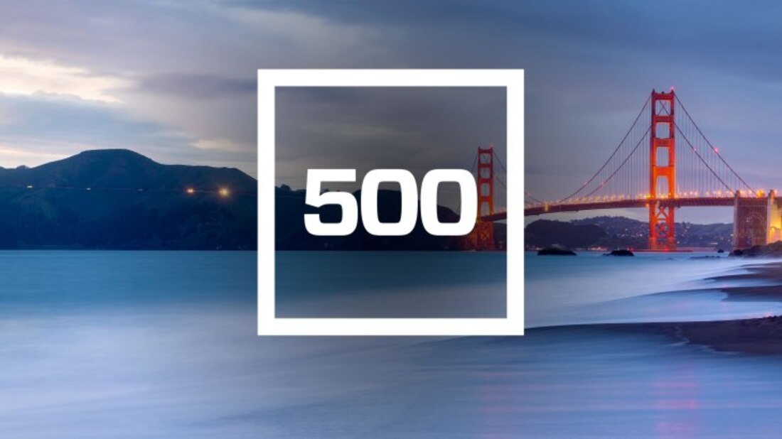 The image contains the number 500 on a background of a bridge