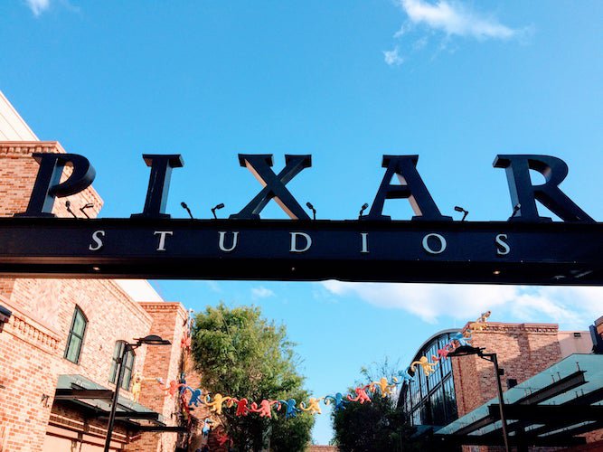 Image for Steve Jobs Pixar article: the logo of pixar studios at the entrance of the building, against a clear blue sky